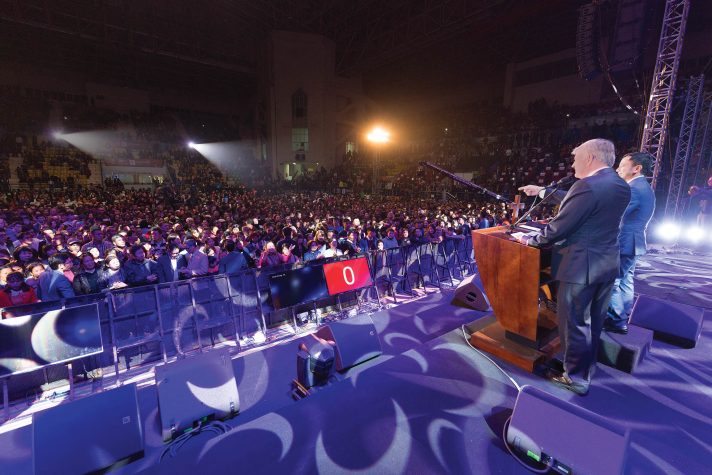 Franklin Graham and interpreter facing crowd
