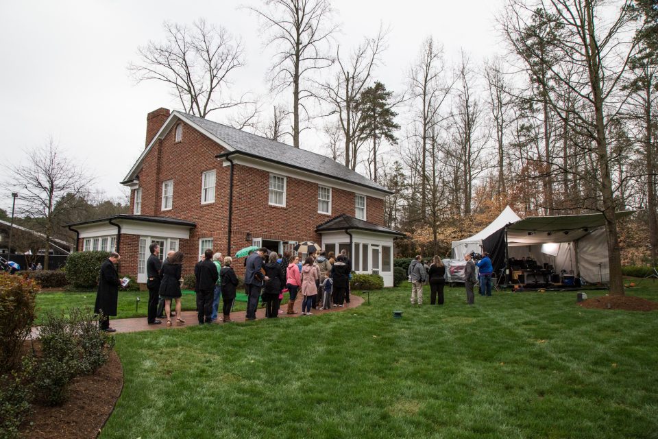 People stand in line outside the Graham family Homeplace