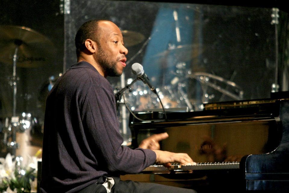 Huntley Brown playing piano and singing