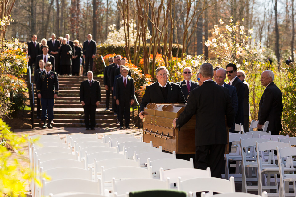 Pallbearers carry Mr. Graham's casket to the interment service