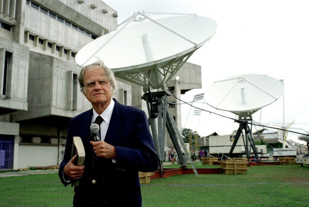 Billy Graham with satellites behind him