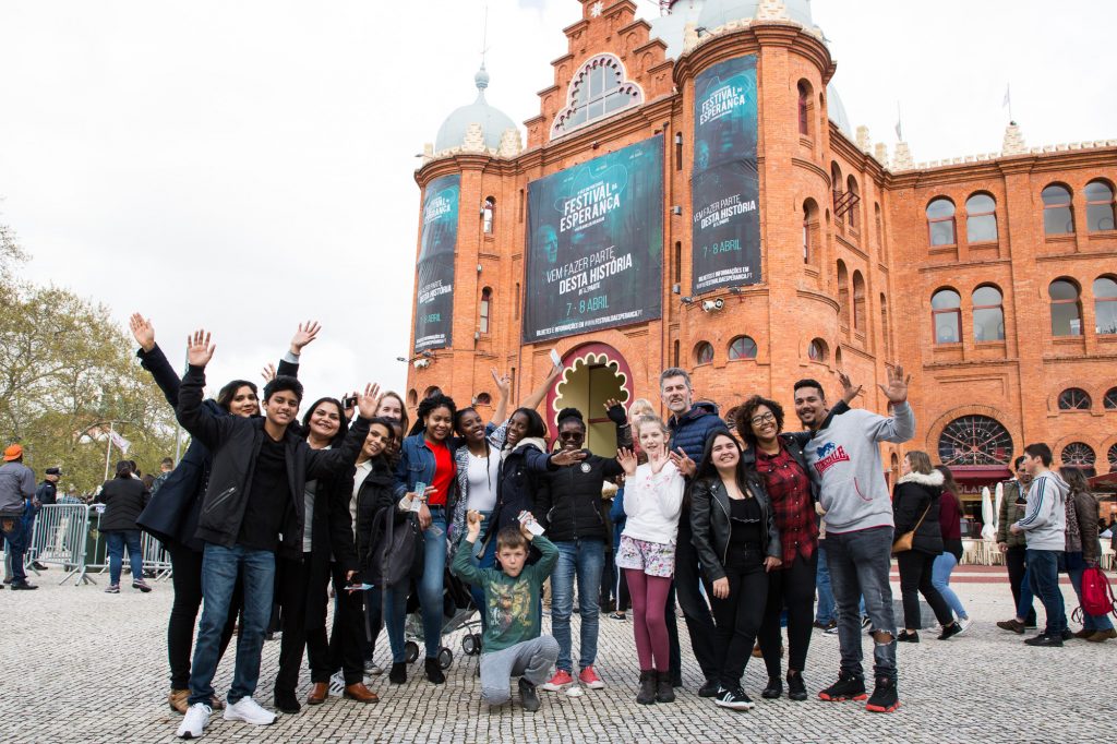 Happy people standing in front of Lisbon's Campo Pequeno