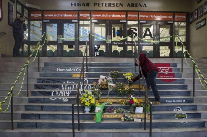 man places flowers on steps