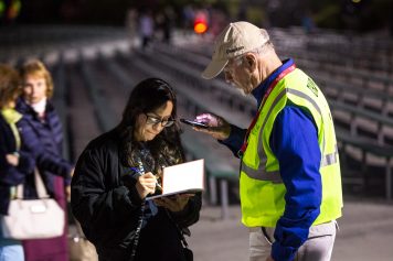 chaplain shining light so woman can read