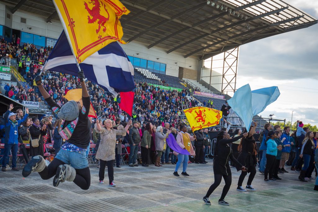 Flags among crowd in stadium