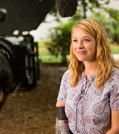 Tiffany Johnson in front of a camera.