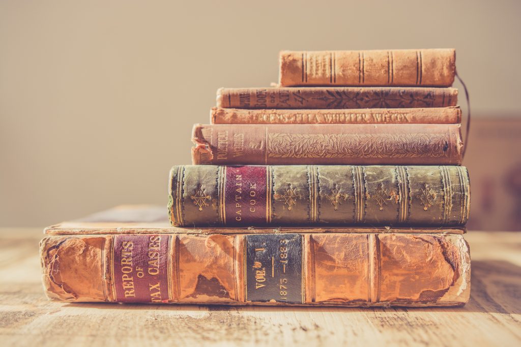 six books piled 
on one another