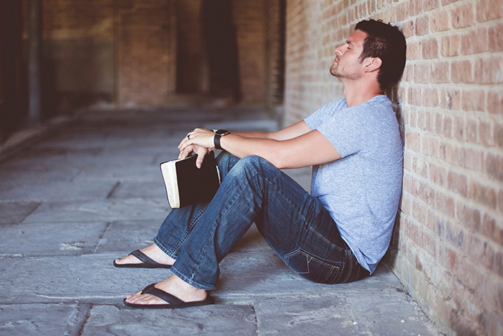 Man Leaning Against Wall Feature