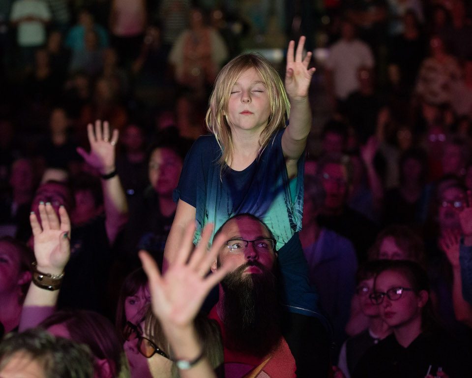 girl with raised hands