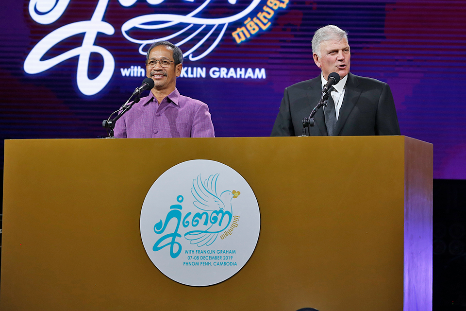 Interpreting the Gospel message into the local Khmer language this weekend was Barnabas Mam, pictured on the left. Mam was one of only about 200 Christians who survived the four-year Cambodian genocide, which targeted many religious groups.