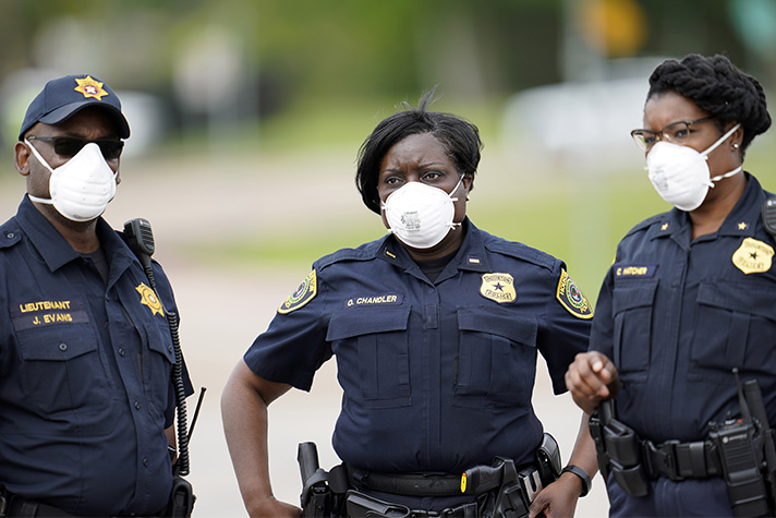 A medical officer wearing a medical first responder's uniform. The