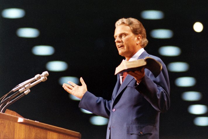Billy Graham preaching with Bible
