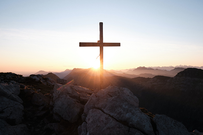 Wooden cross in the mountains