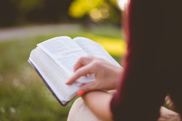 woman holding Bible