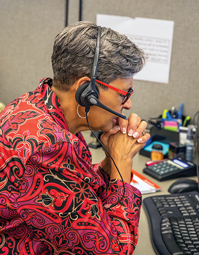 Woman with headset praying