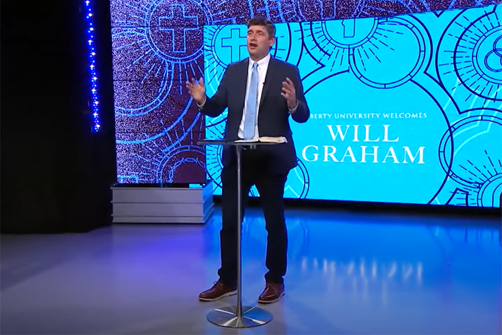 Will Graham speaking from stage at Liberty University