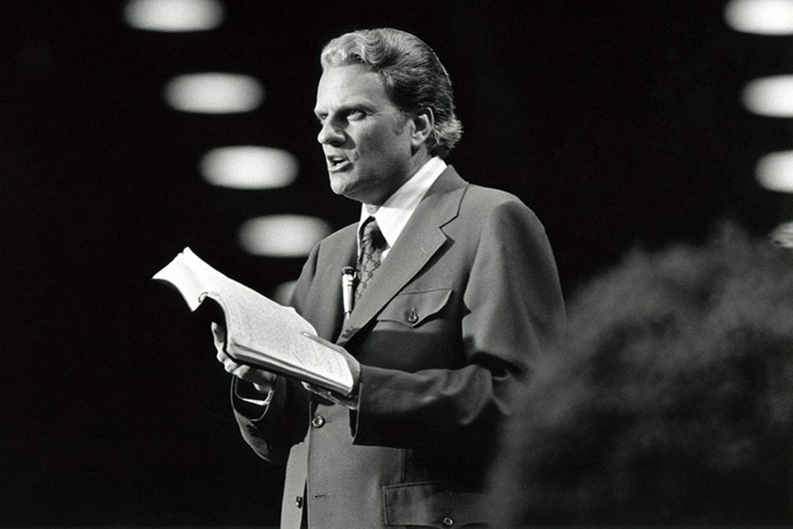 Billy Graham holding Bible