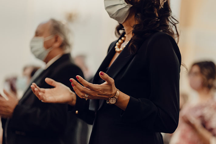 Woman worshipping at church