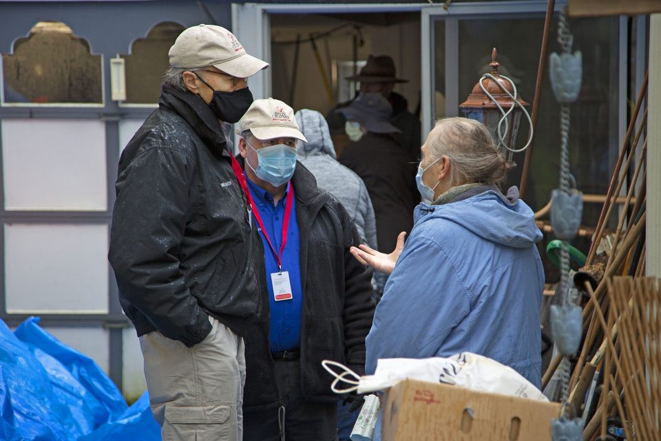 Chaplains talk with woman outside