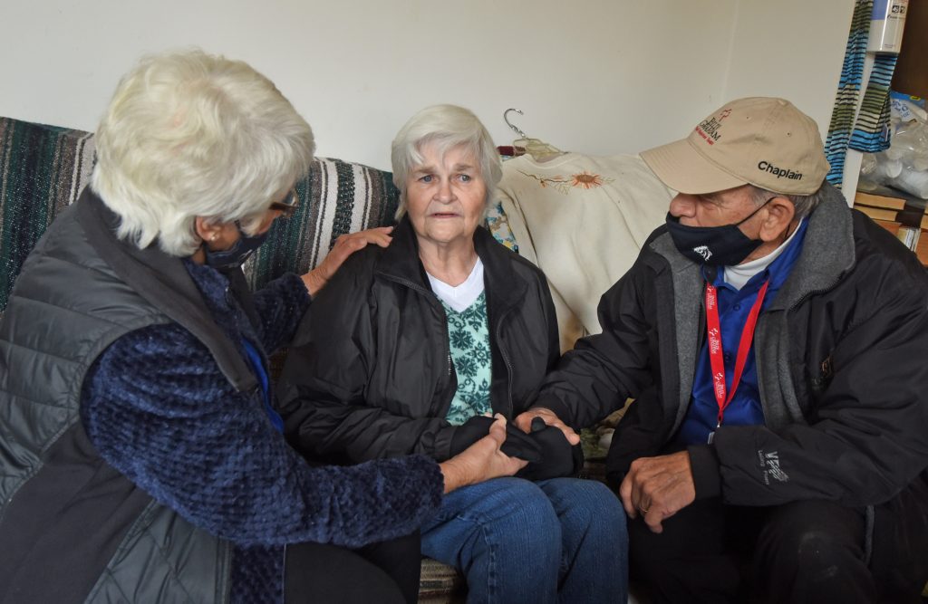 chaplains with an elderly woman