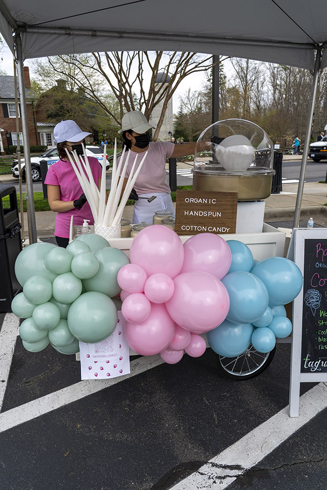 Balloons in front of cotton candy stand