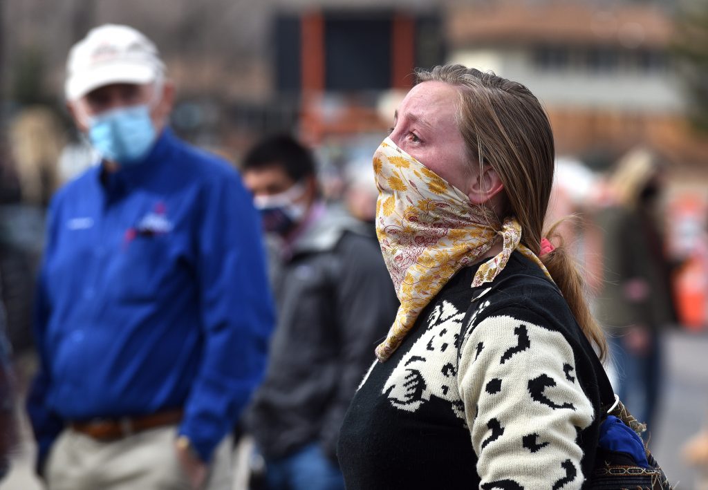 Woman cries at memorial