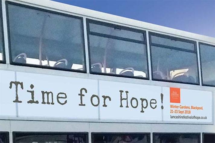 Ad on side of bus that reads "Time for hope!"