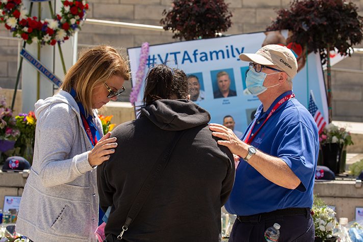 chaplain prays with two women