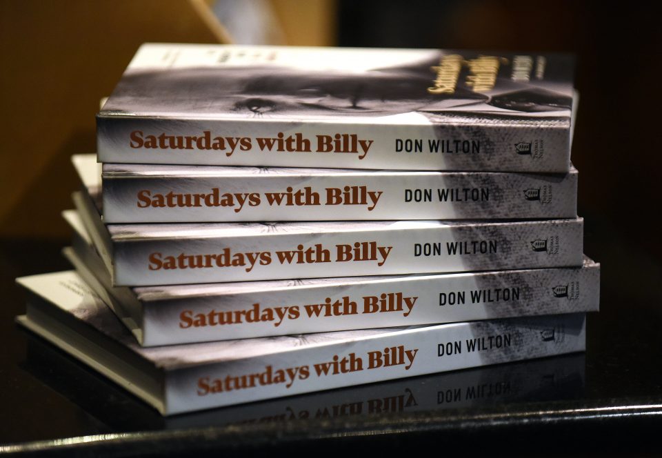 A stack of "Saturdays with Billy" books