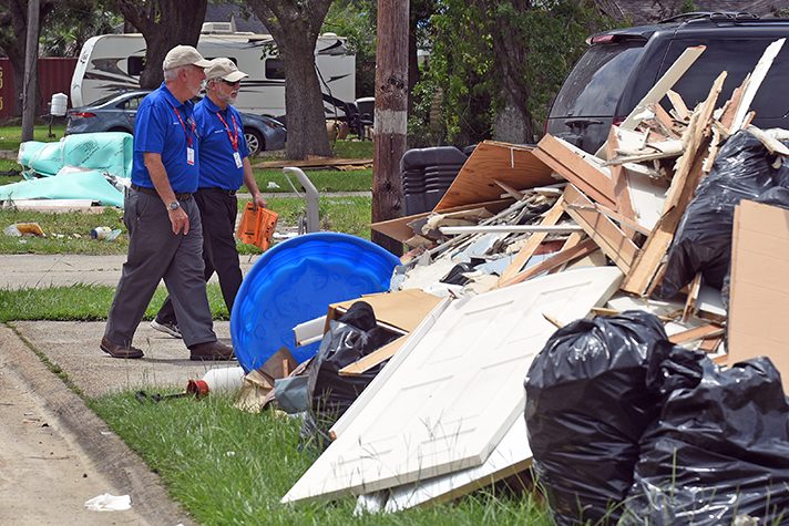 Billy Graham chaplains walk past rubble