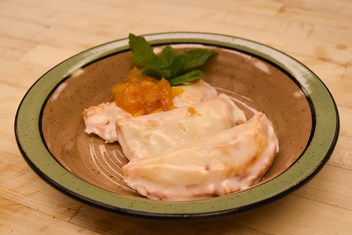 Peach turnovers in bowl