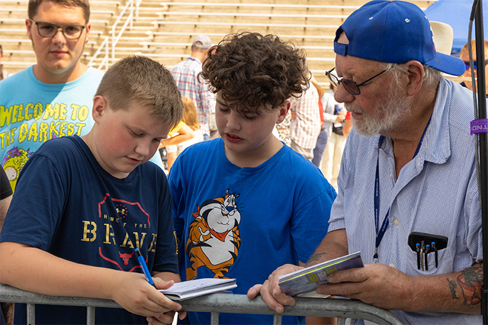 Students with prayer volunteer