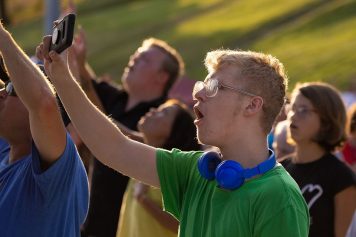 boy holding cellphone