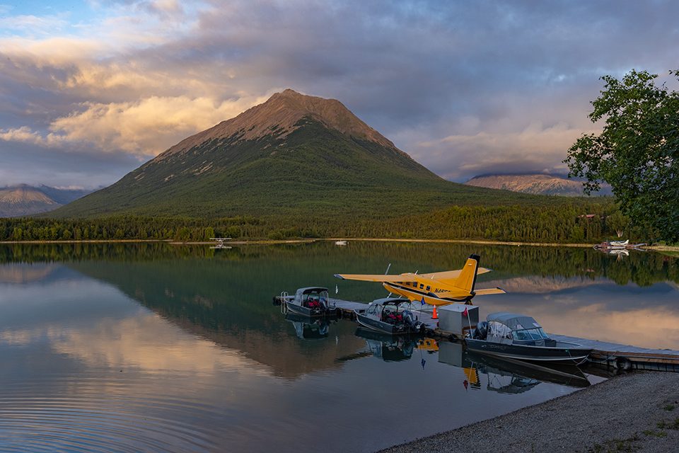 plane against Alaskan mountains