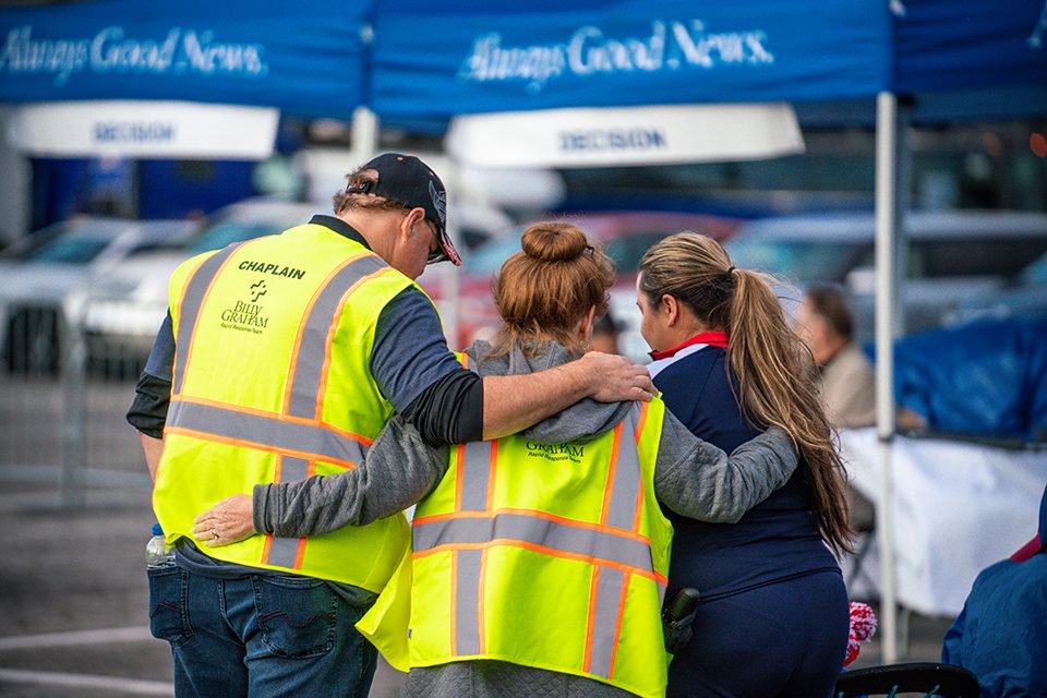 Billy Graham chaplains pray with woman