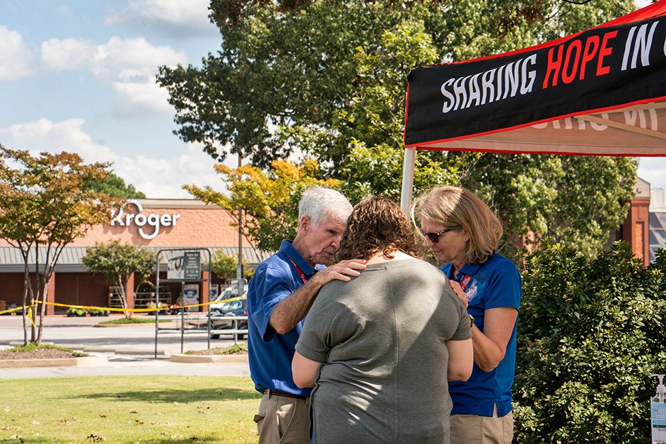 chaplains pray with woman outside kroger grocery store