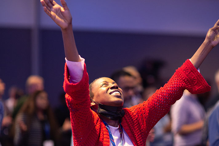 Woman raising hands in worship