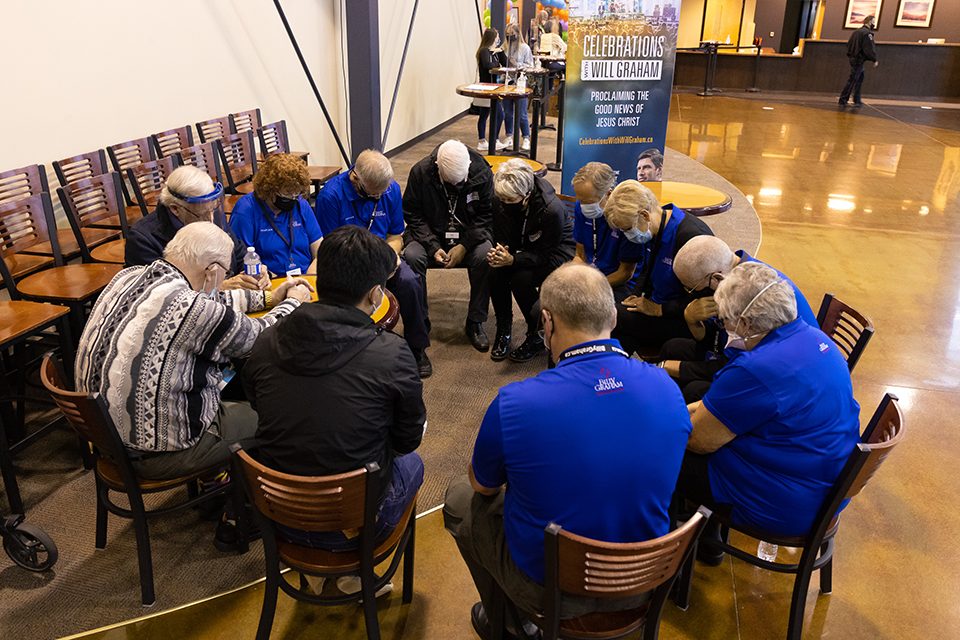 group praying in a circle