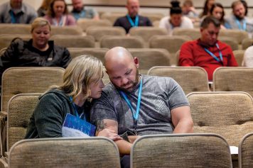 couple sitting close together