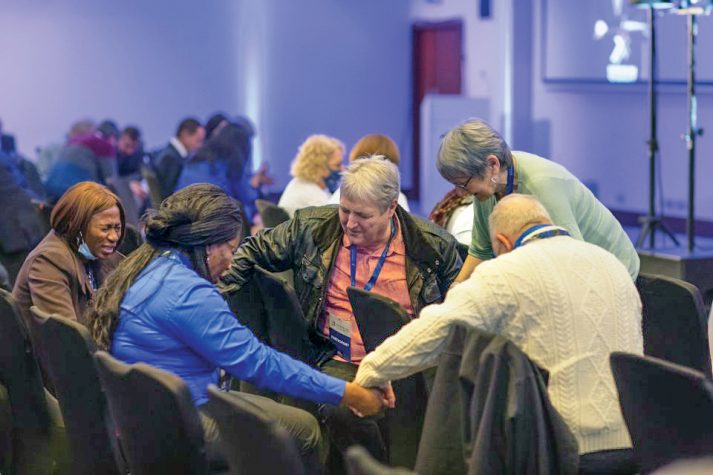 group of people praying