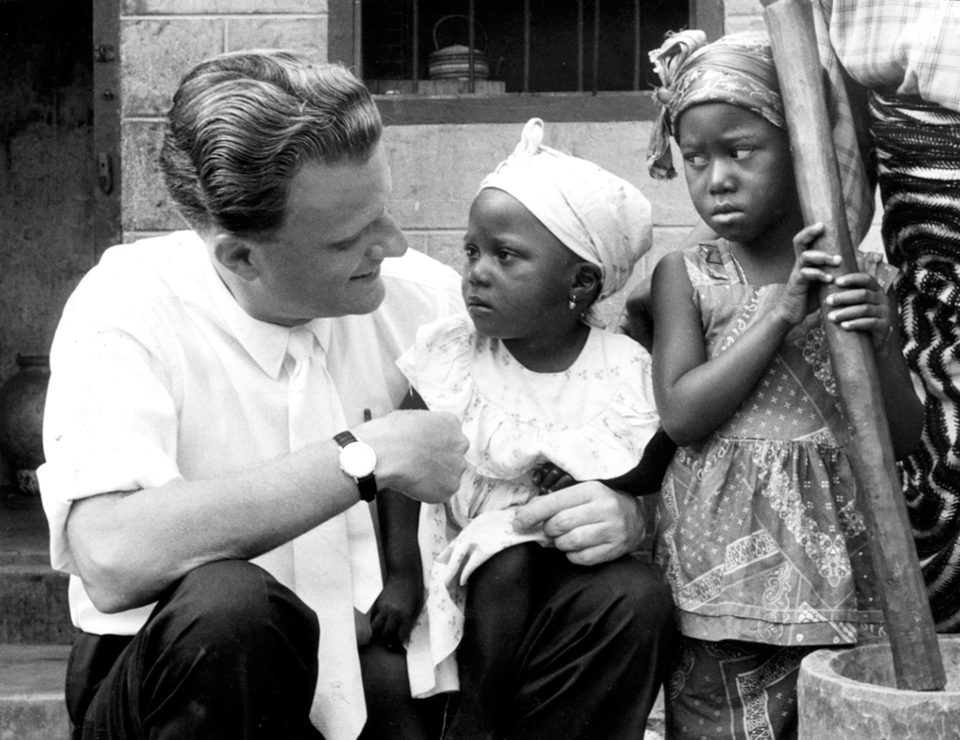 Billy Graham holding young child