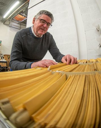 Jeff Kelch looking through folders