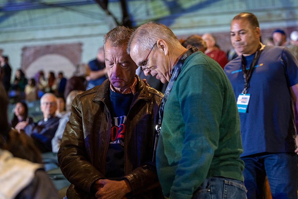 Two men praying 