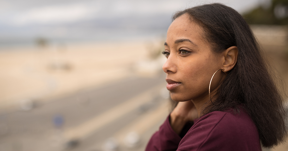 Side Profile Of A Beautiful Young Black Woman Thinking And Looking