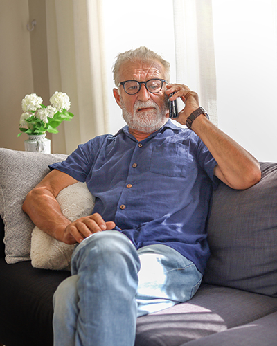 Man sitting talking on phone.