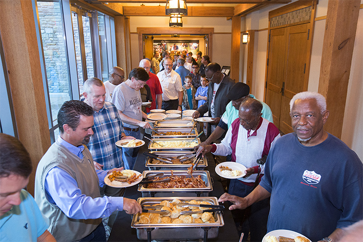 More than 200 men filled their plates with a hot breakfast before hearing the Benhams’ message. Many brought friends and family.