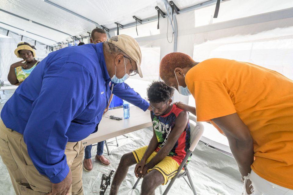 RRT chaplains praying with Haitian teen