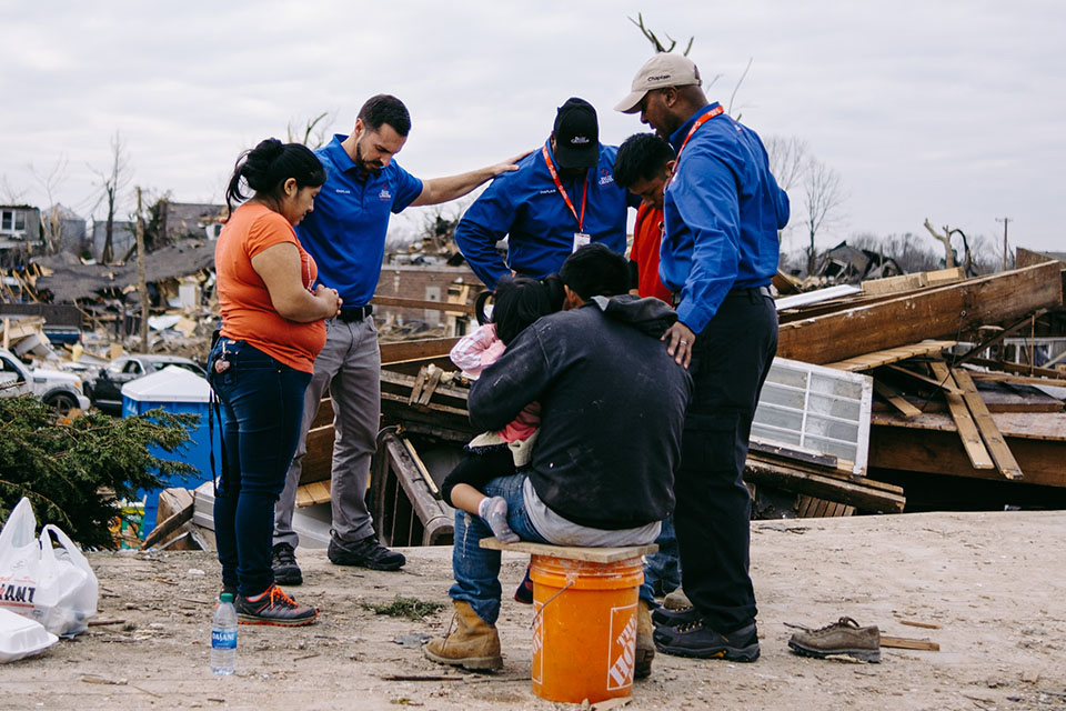 RRT chaplains praying with locals in Kentucky after tornado aftermath