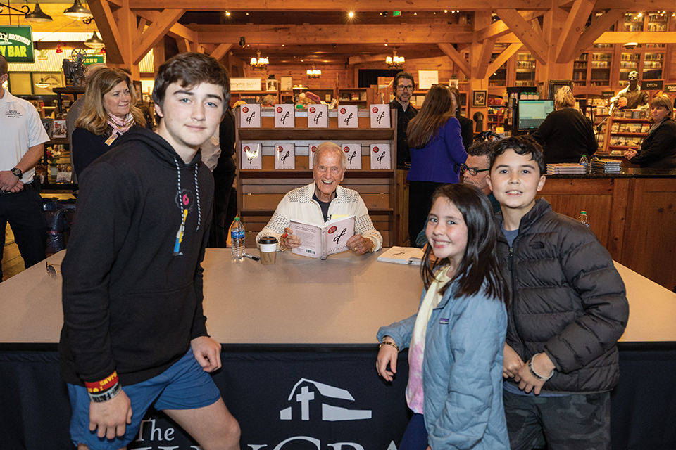 3 young people in photo with Pat Boone.