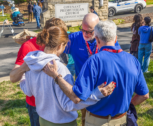 woman talking with 2 chaplains